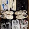 The photo shows a package with footwear in the category SH.
