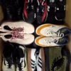 The photo shows a package with footwear in the category SH.