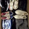 The photo shows a package with footwear in the category SH.