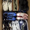 The photo shows a package with footwear in the category SH.