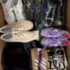 The photo shows a package with footwear in the category SH.