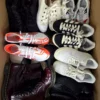 The photo shows a package with footwear in the category SH.