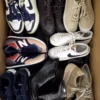 The photo shows a package with footwear in the category SH.
