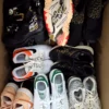 The photo shows a package with footwear in the category SH.