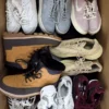 The photo shows a package with footwear in the category SH.