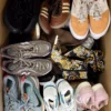 The photo shows a package with footwear in the category SH.