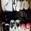 The photo shows a package with footwear in the category SH.