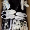 The photo shows a package with footwear in the category SH.