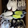 The photo shows a package with footwear in the category SH.
