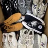 The photo shows a package with footwear in the category SH.
