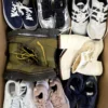 The photo shows a package with footwear in the category SH.