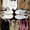 The photo shows a package with footwear in the category SH.