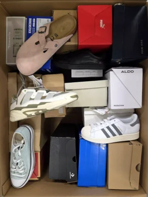 The photo shows a package with footwear in the category BS.