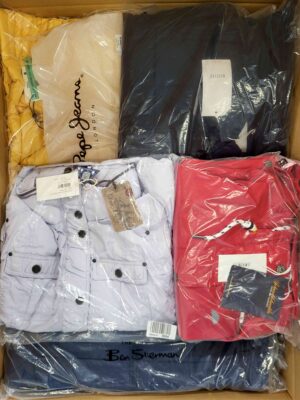 The photo shows a package with clothing in the category AJS.