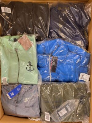 The photo shows a package with clothing in the category AJS.