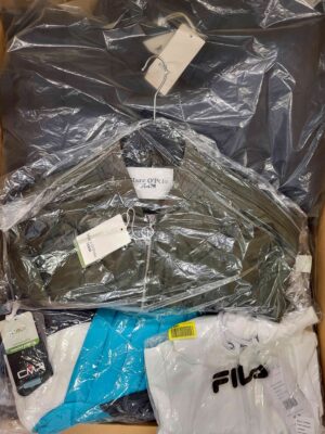 The photo shows a package with clothing in the category AJS.