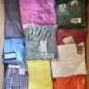 The photo shows a package with clothing in the category AR.