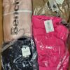 The photo shows a package with clothing in the category AJW.