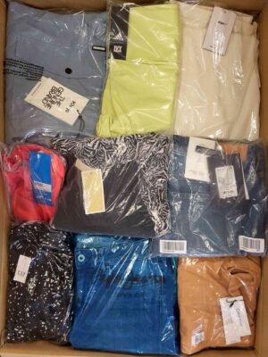 The photo shows a package with clothing in the category AW.