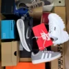 The photo shows a package with footwear in the category CS.