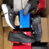 The photo shows a package with footwear in the category CS.