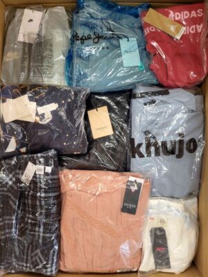 The photo shows a package with clothing in the category AW.