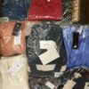 The photo shows a package with clothing in the category AW.