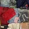 The photo shows a package with clothing in the category SN.