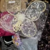 The photo shows a package with clothing in the category SN.