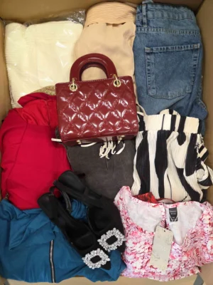 The photo shows a package with clothing in the category SN.