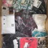 The photo shows a package with clothing in the category AP.
