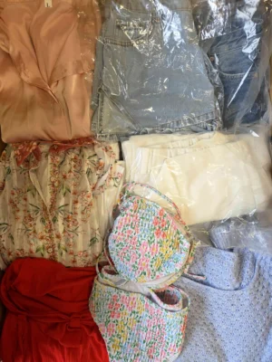 The photo shows a package with clothing in the category SN.