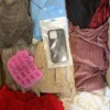 The photo shows a package with clothing in the category SN.