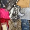 The photo shows a package with clothing in the category SN.