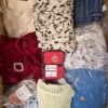The photo shows a package with clothing in the category SN.