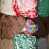 The photo shows a package with clothing in the category SN.