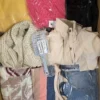 The photo shows a package with clothing in the category SN.