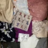 The photo shows a package with clothing in the category SN.