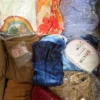 The photo shows a package with clothing in the category SN.