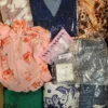 The photo shows a package with clothing in the category SN.