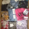 The photo shows a package with clothing in the category AP.