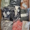 The photo shows a package with clothing in the category YA.