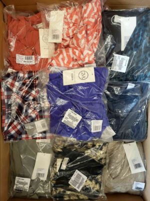 The photo shows a package with clothing in the category YA.