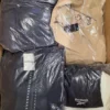 BJ114 1 The photo shows a package with clothing in the category B.