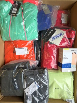 The photo shows a package with footwear in the category AS.