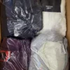 BJ120 2 The photo shows a package with clothing in the category B.