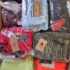 The photo shows a package with footwear in the category AS.