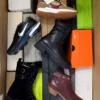 The photo shows a package with footwear in the category AS.
