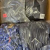 CJ123 1 The photo shows a package with clothing in the category C.