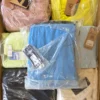 The photo shows a package with footwear in the category AS.